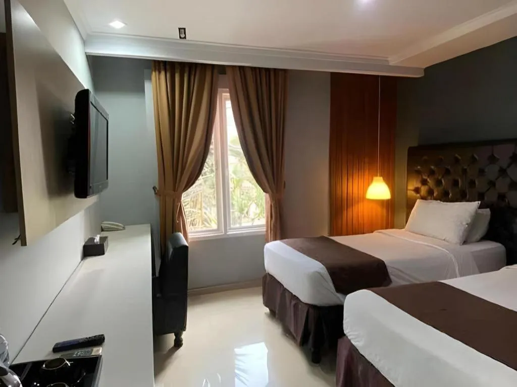 Bed in Rizen Premiere Hotel