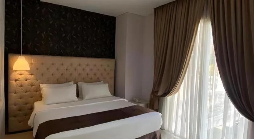 Bed in Rizen Premiere Hotel
