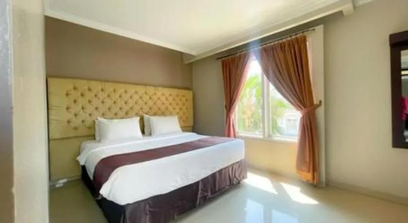 Bed in Rizen Premiere Hotel