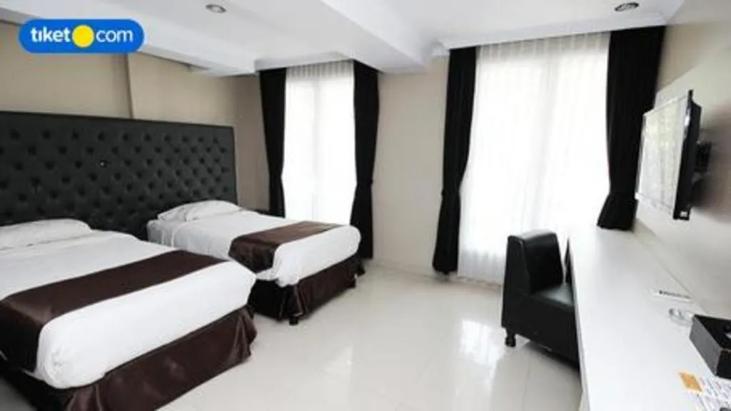 Bed in Rizen Premiere Hotel