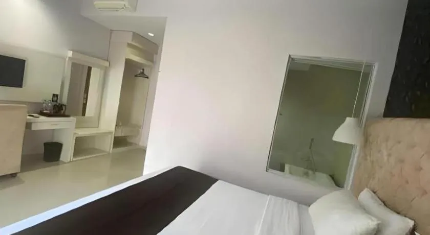 Bed in Rizen Premiere Hotel