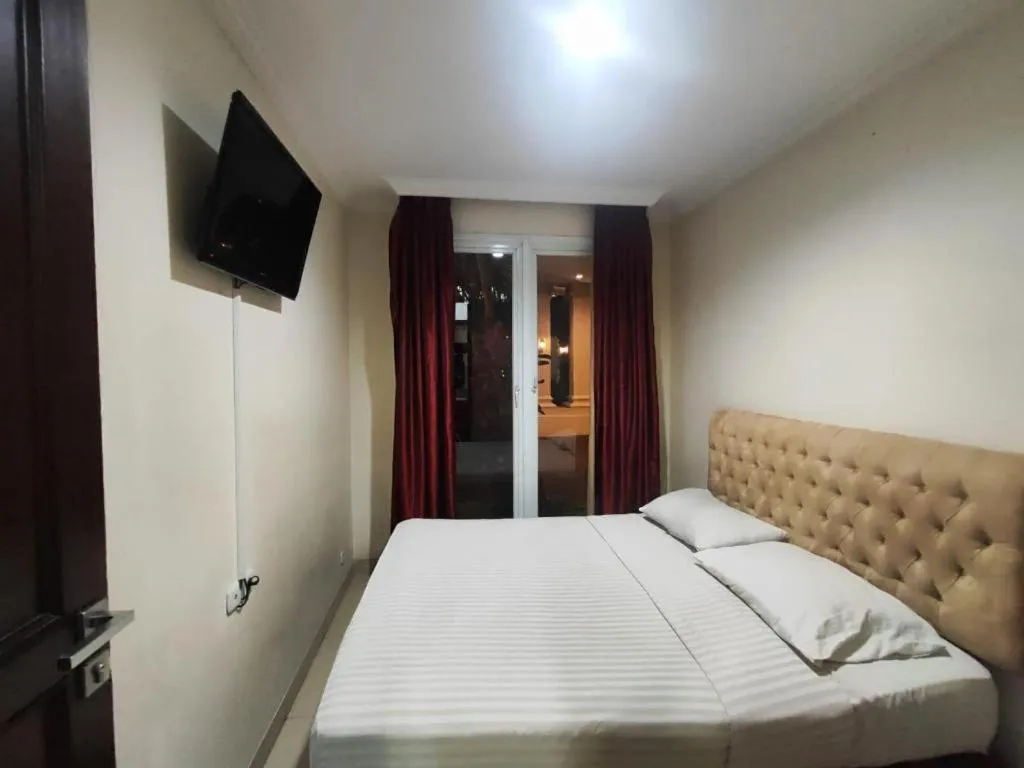 Bed in Rizen Premiere Hotel