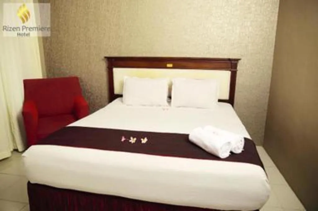 Bed in Rizen Premiere Hotel