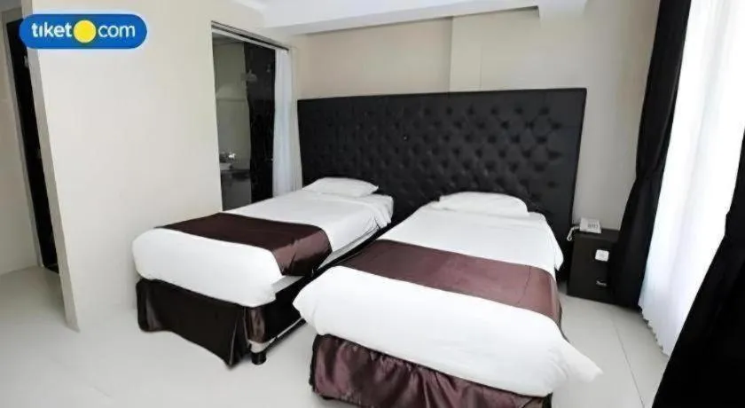 Bed in Rizen Premiere Hotel