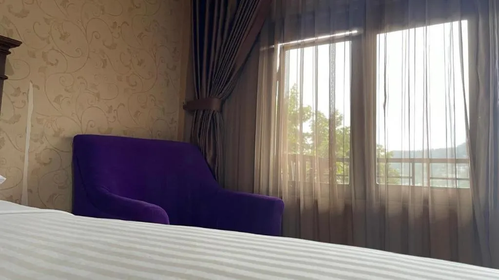 Bed in Rizen Premiere Hotel