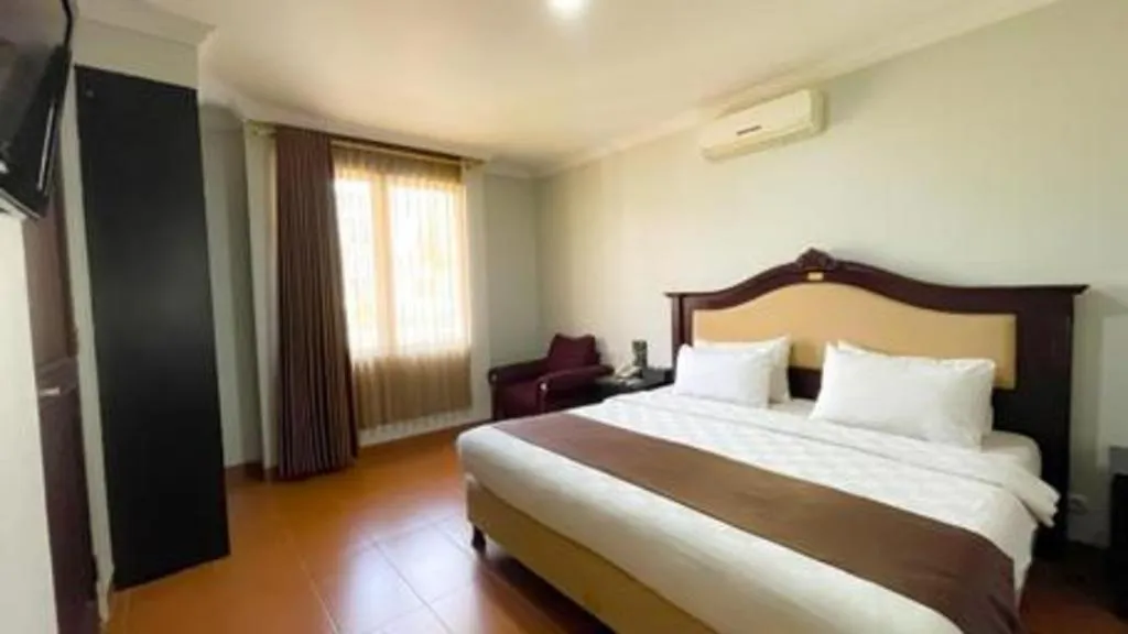 Bed in Rizen Premiere Hotel