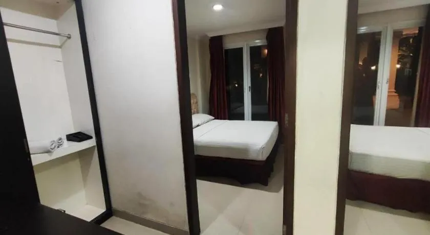 Bed in Rizen Premiere Hotel