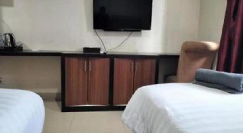 Bed in Rizen Premiere Hotel