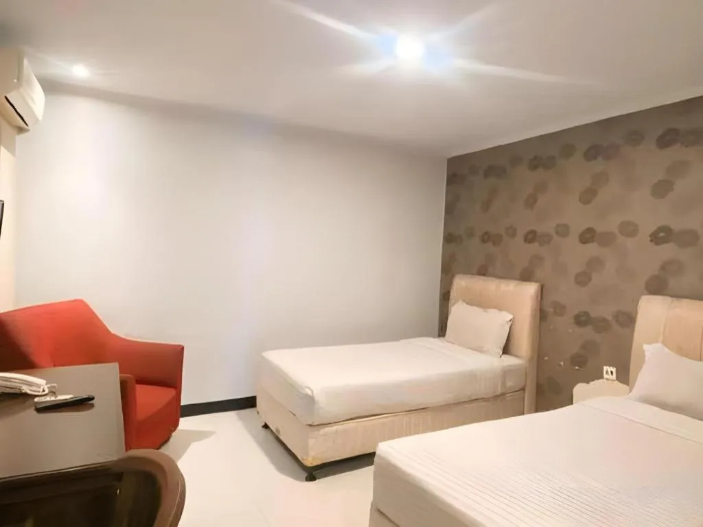 Bed in Rizen Premiere Hotel