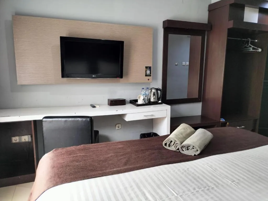 Bed in Rizen Premiere Hotel