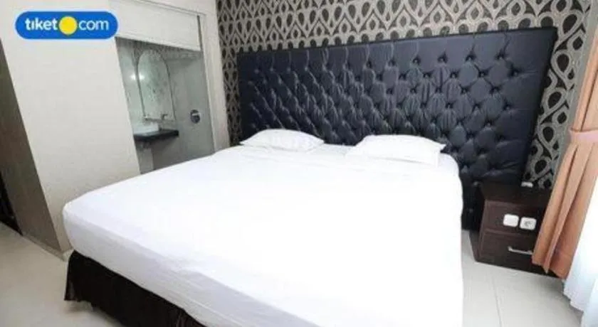 Bed in Rizen Premiere Hotel