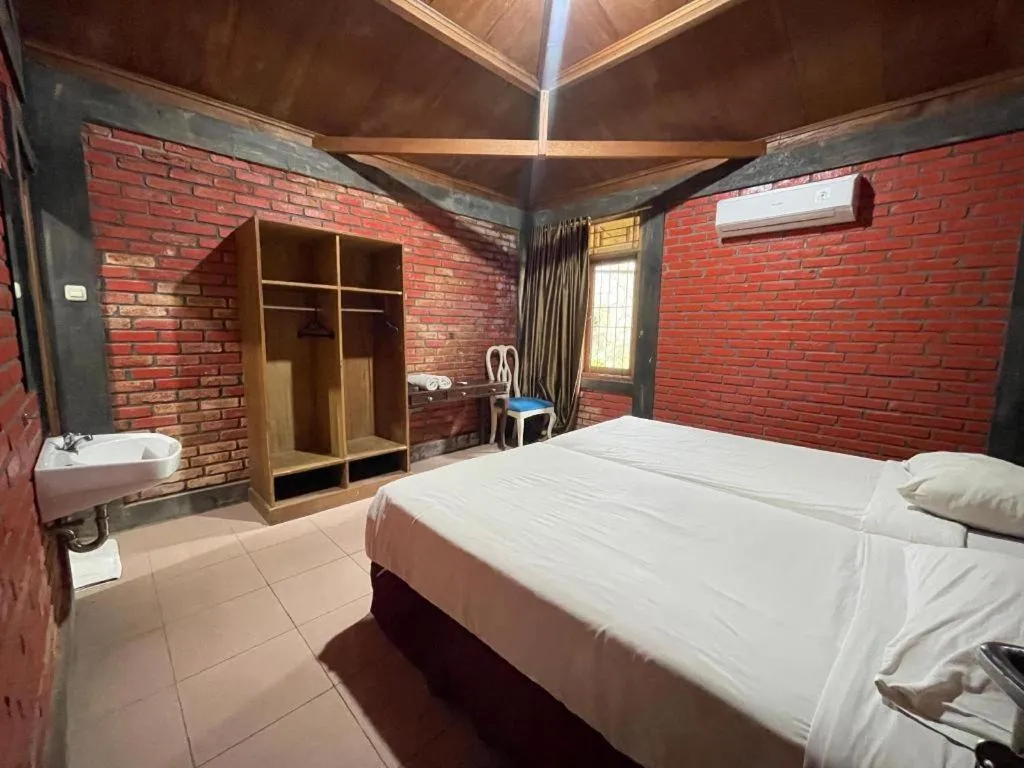 Bed in Rizen Premiere Hotel