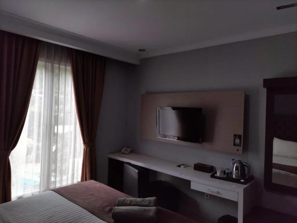 Bed in Rizen Premiere Hotel