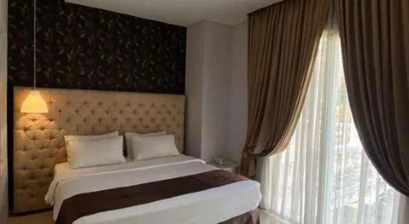 Bed in Rizen Premiere Hotel