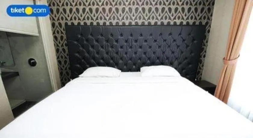 Bed in Rizen Premiere Hotel