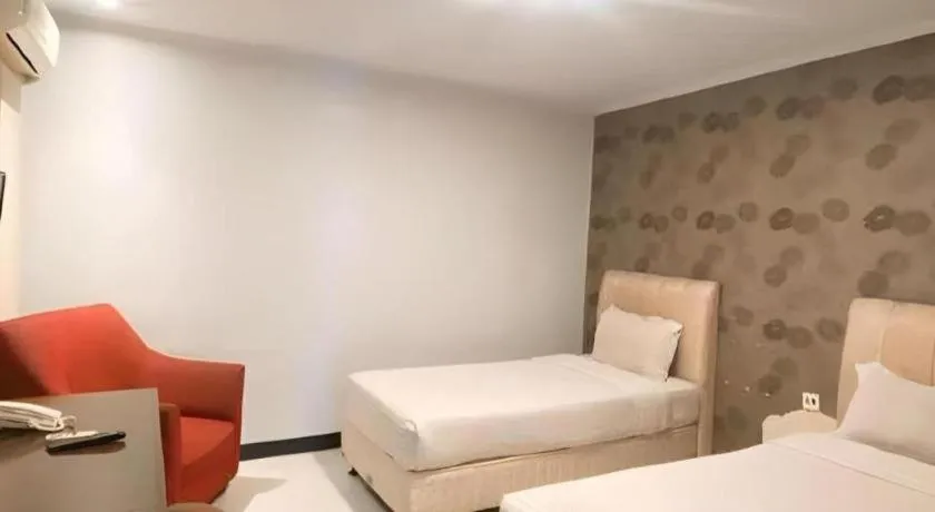 Bed in Rizen Premiere Hotel