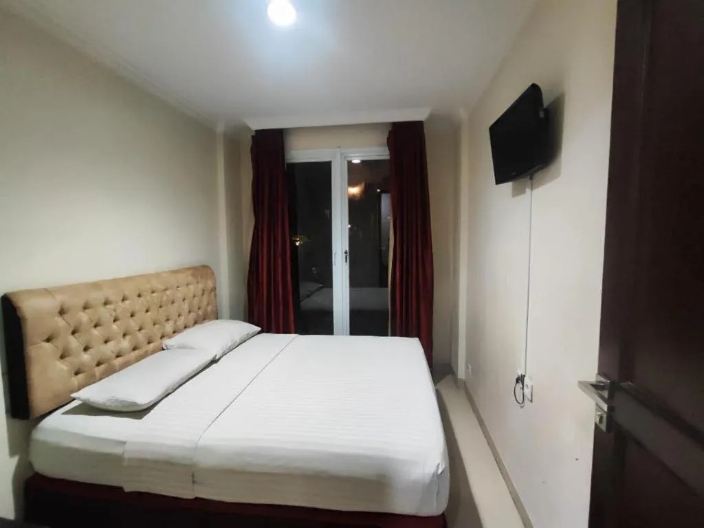 Bed in Rizen Premiere Hotel