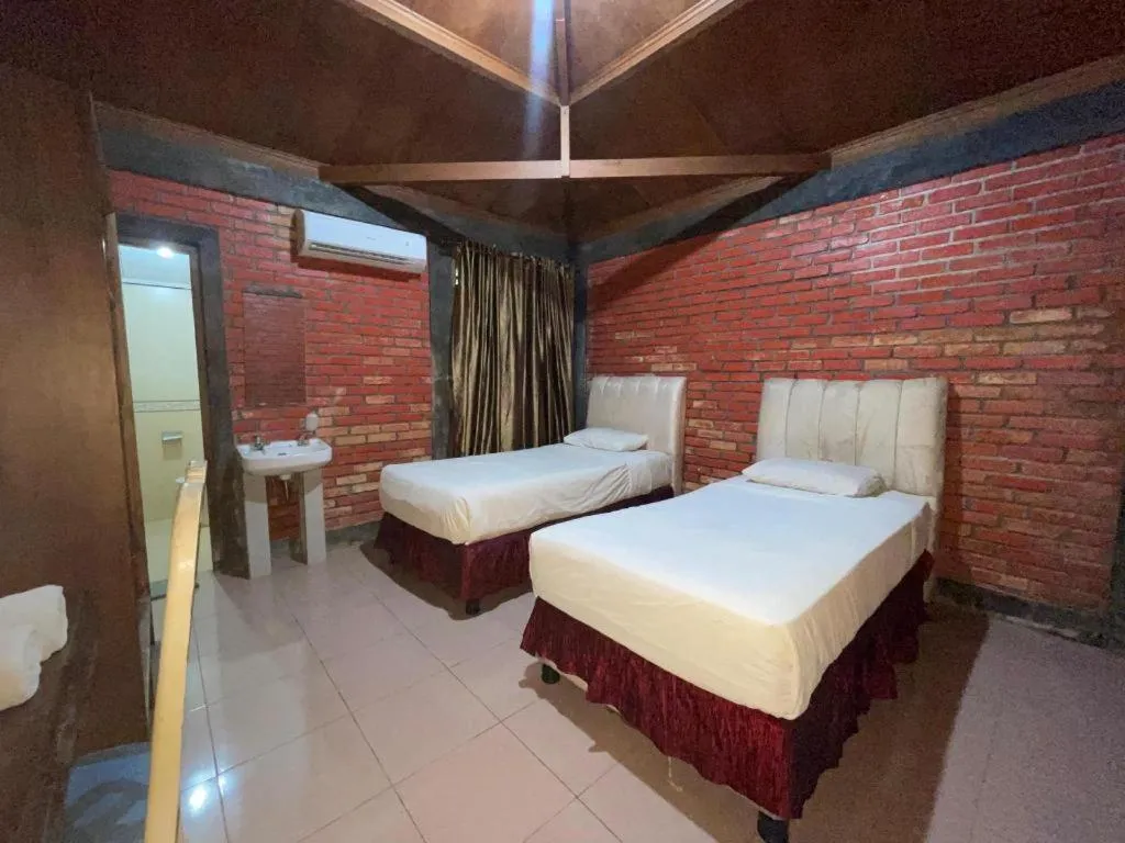 Bed in Rizen Premiere Hotel