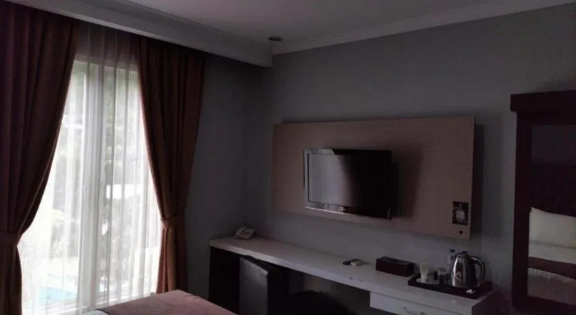 Bed in Rizen Premiere Hotel