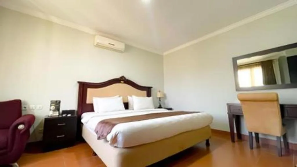 Bed in Rizen Premiere Hotel