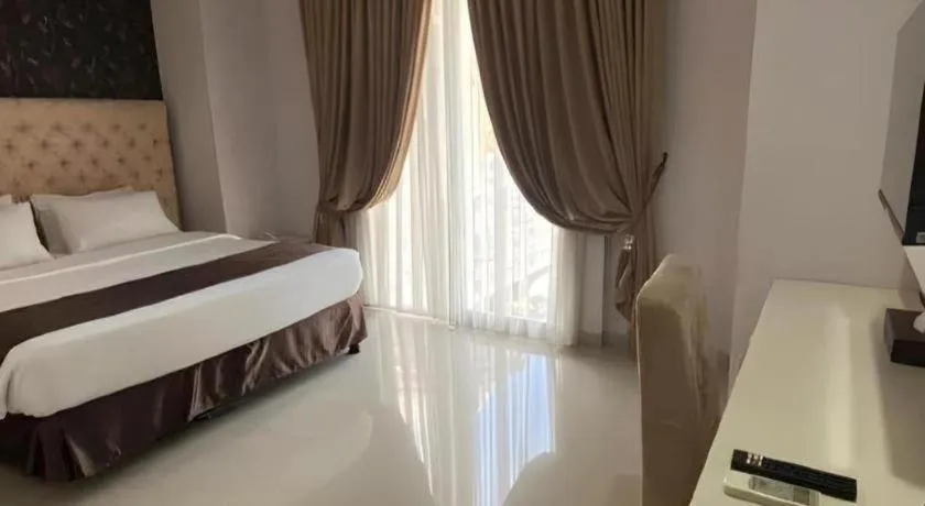 Bed in Rizen Premiere Hotel