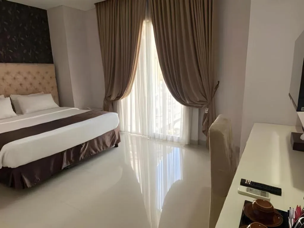 Bed in Rizen Premiere Hotel