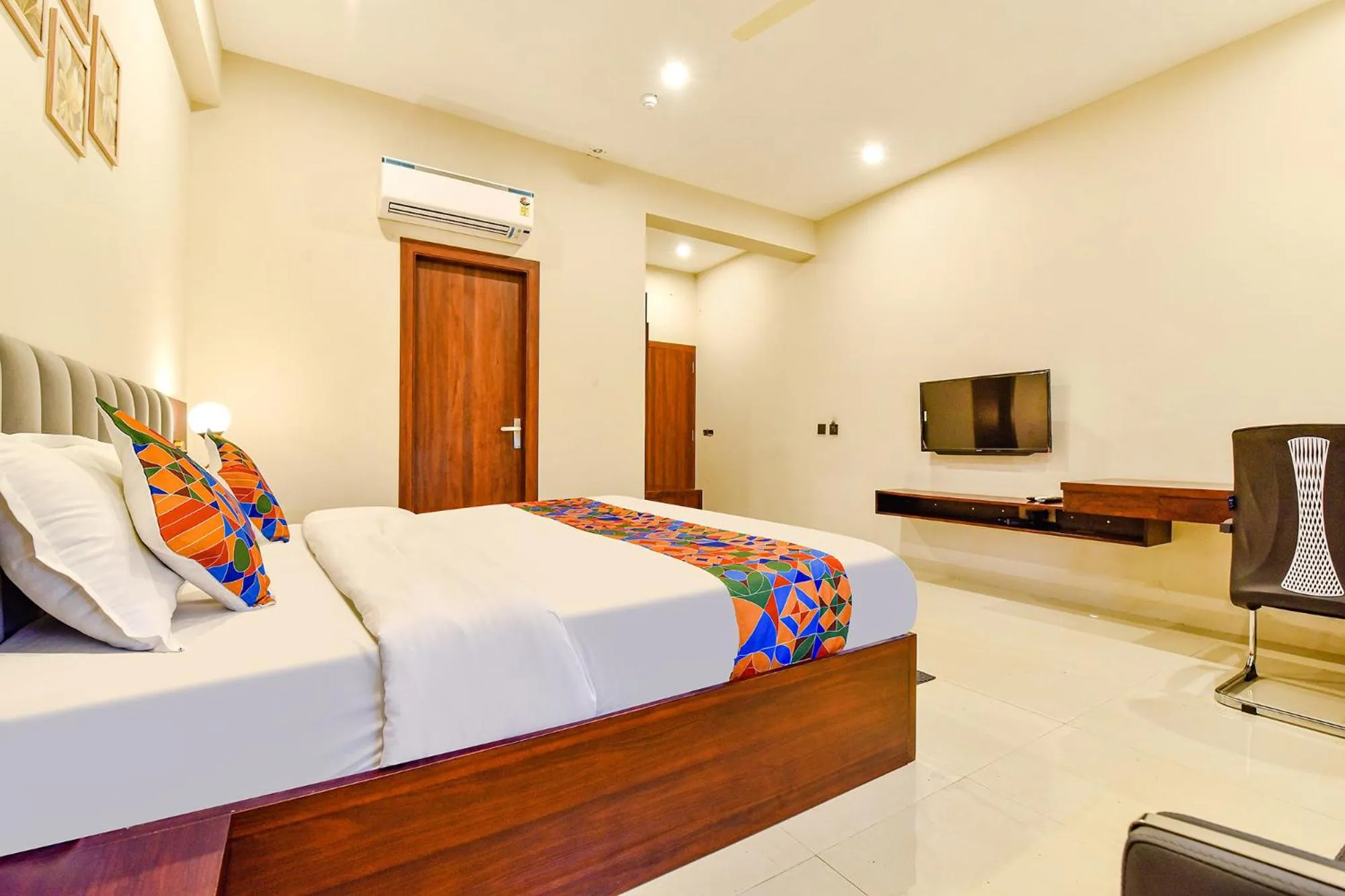 Bed in FabHotel Pravaasam Residency