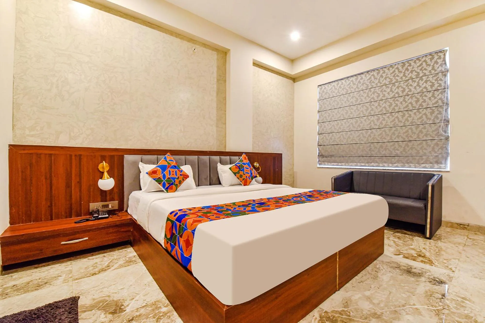 Bed in FabHotel Pravaasam Residency