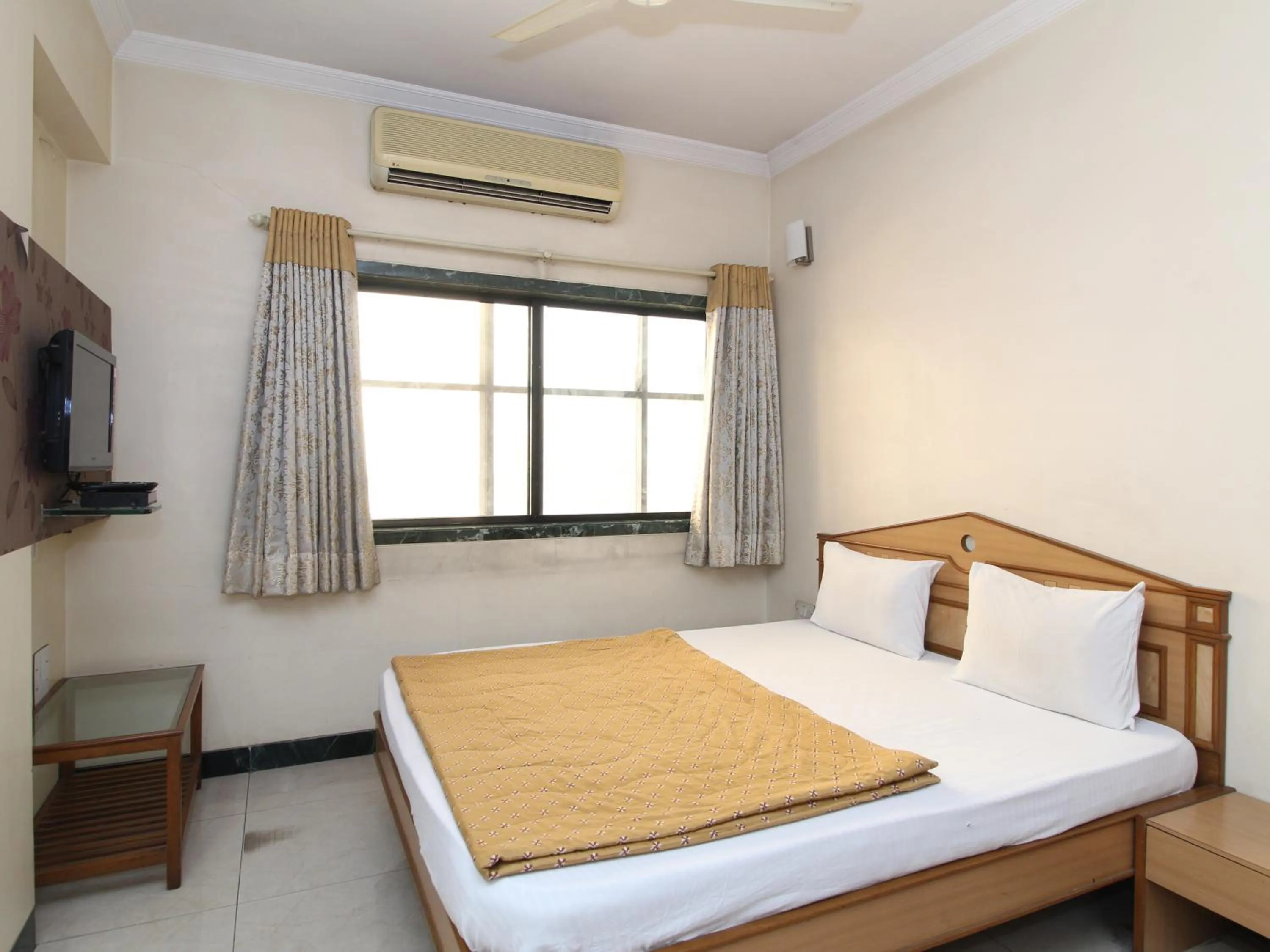 Bed in Hotel Pooja International