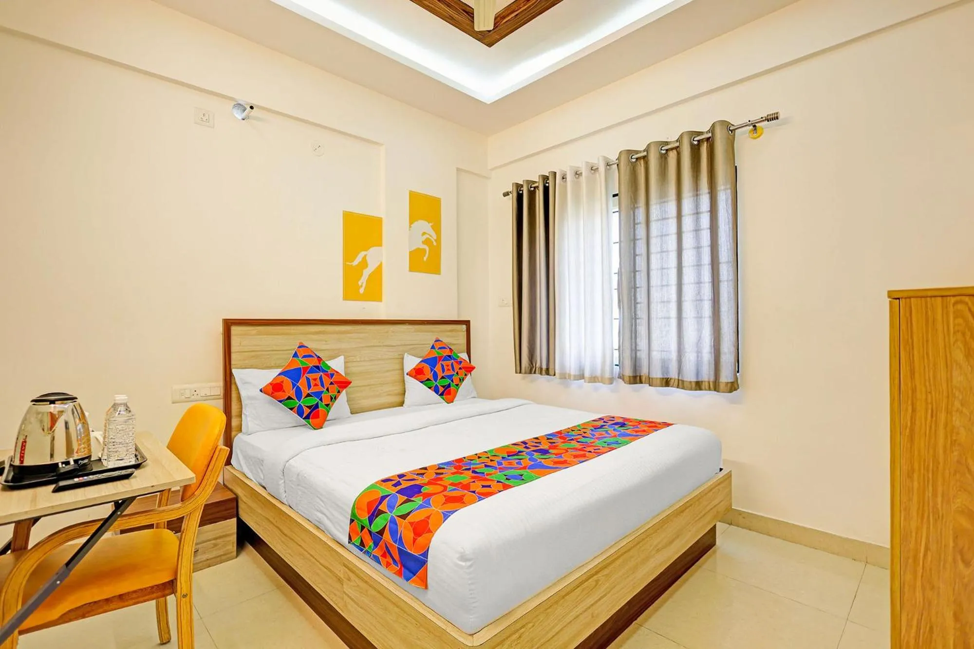 Bed in FabHotel Marella Grand Inn