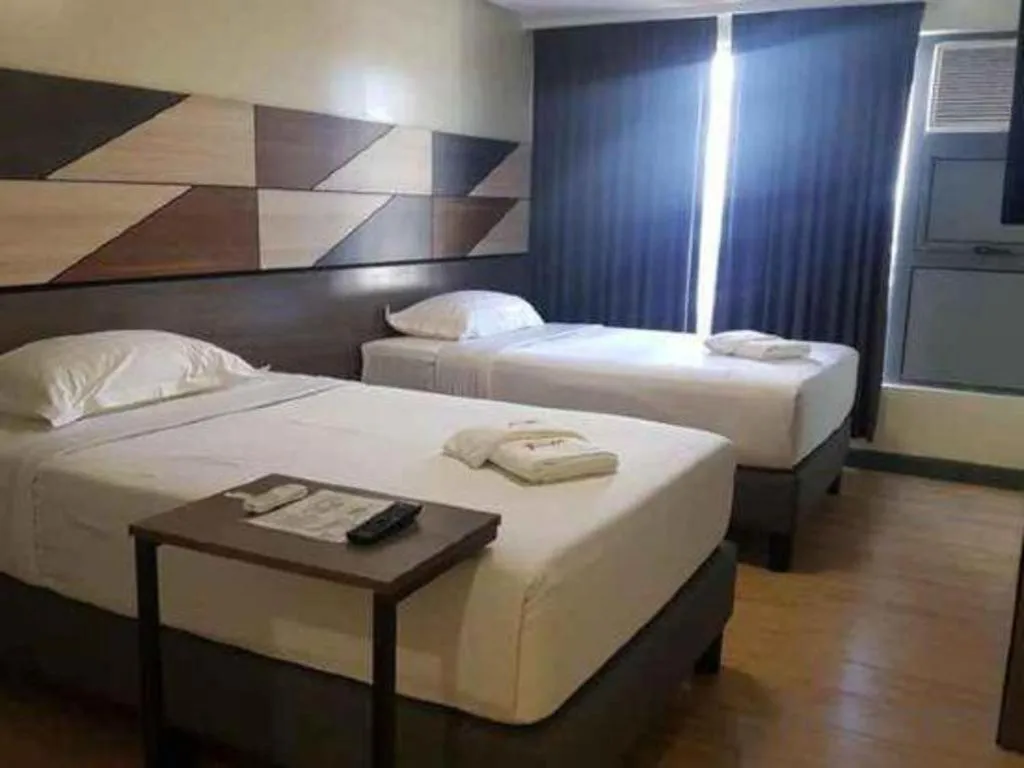 Bed in Travelite Hotel Legarda