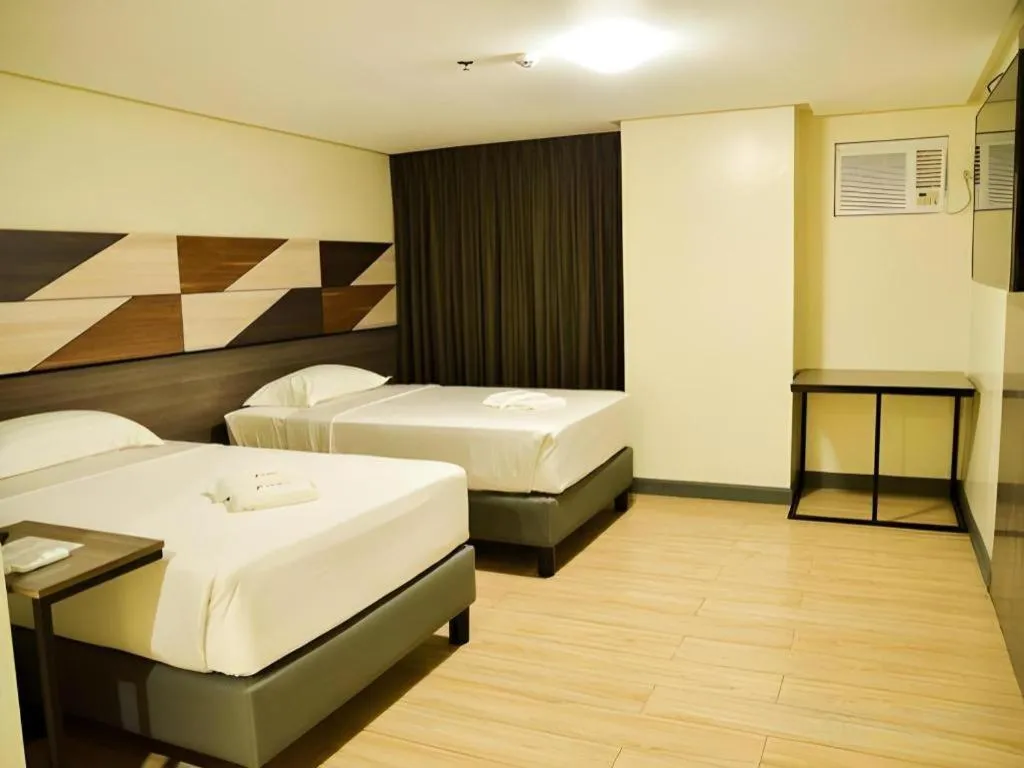 Bed in Travelite Hotel Legarda