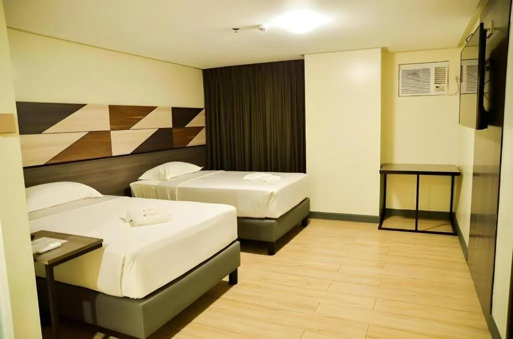 Bed in Travelite Hotel Legarda