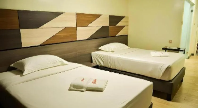 Bed in Travelite Hotel Legarda