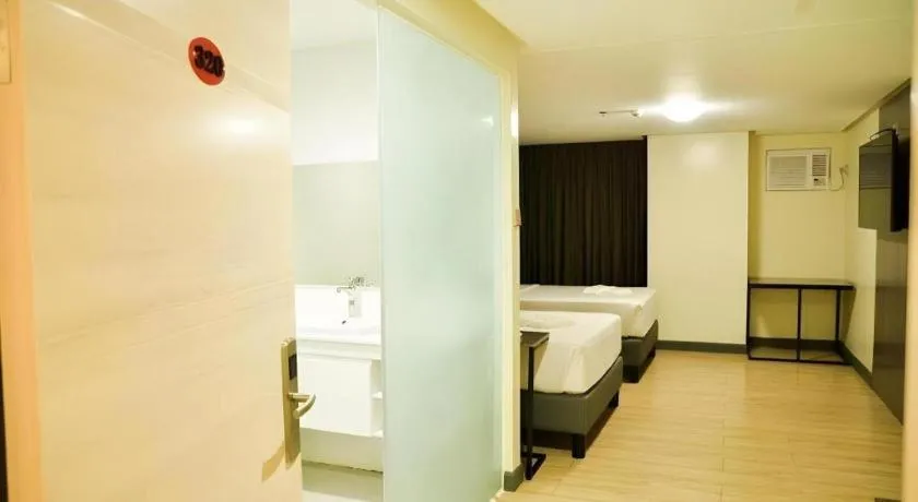 Bed in Travelite Hotel Legarda