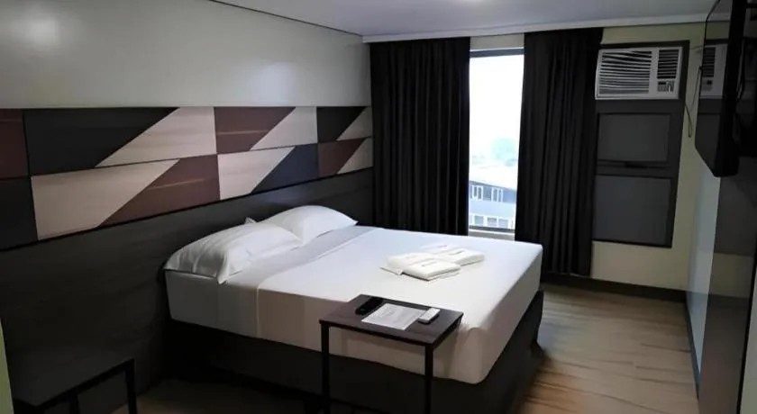 Bed in Travelite Hotel Legarda