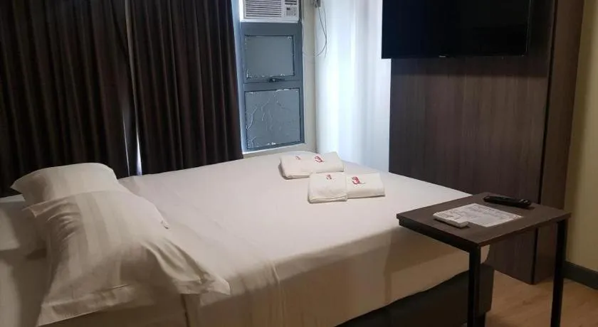 Bed in Travelite Hotel Legarda