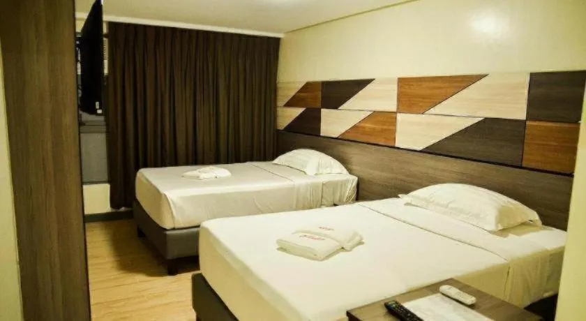 Bed in Travelite Hotel Legarda