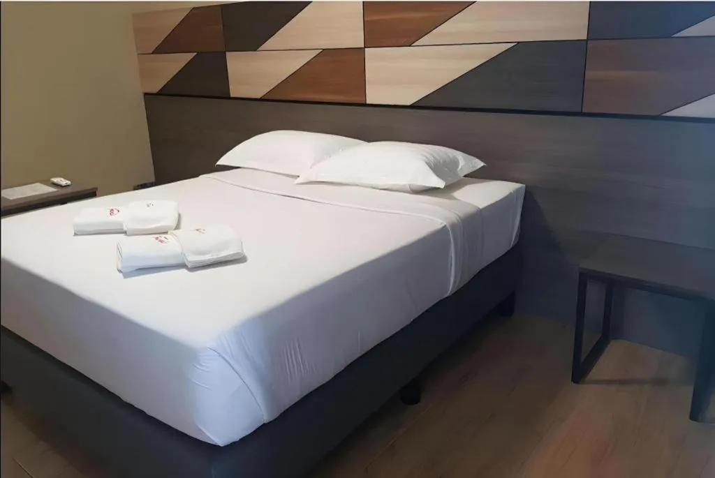 Bed in Travelite Hotel Legarda