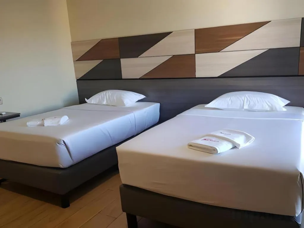 Bed in Travelite Hotel Legarda
