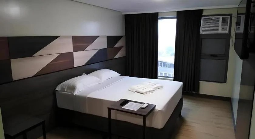 Bed in Travelite Hotel Legarda