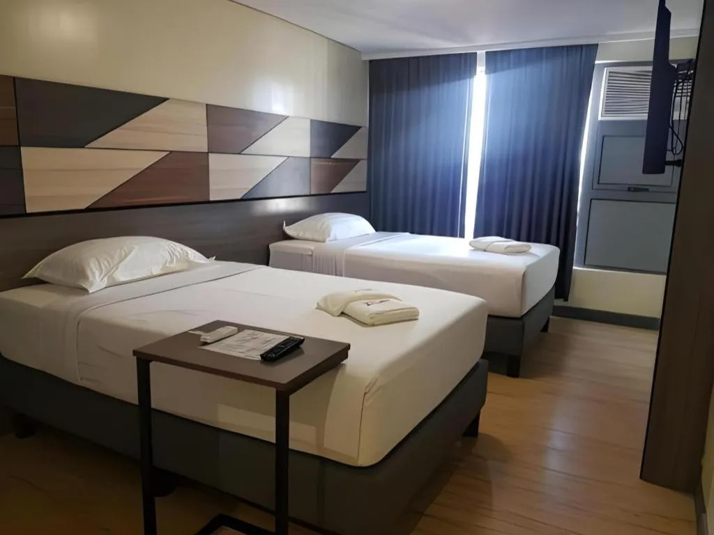 Bed in Travelite Hotel Legarda