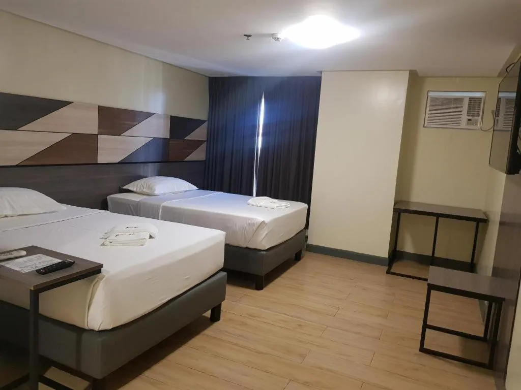 Bed in Travelite Hotel Legarda