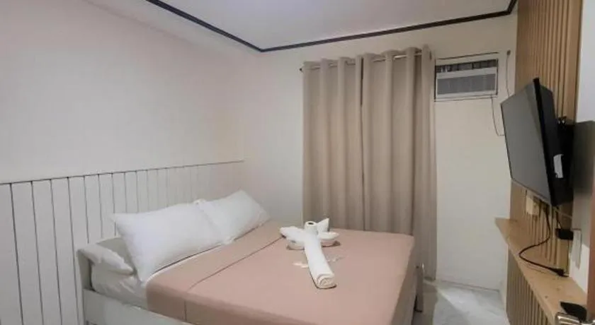 Bed in La Bella Casa Boracay Hotel