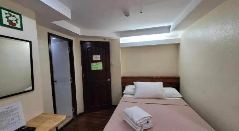 Bed in La Bella Casa Boracay Hotel