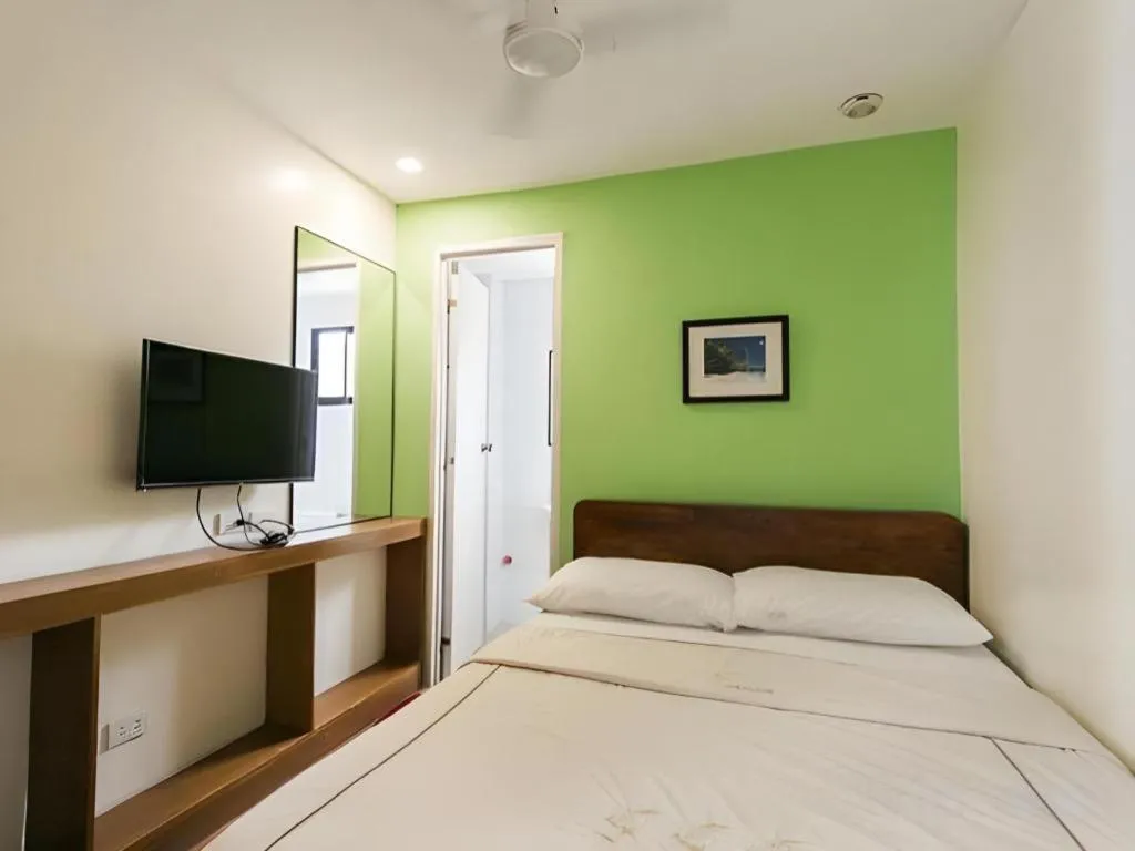 Bed in La Bella Casa Boracay Hotel