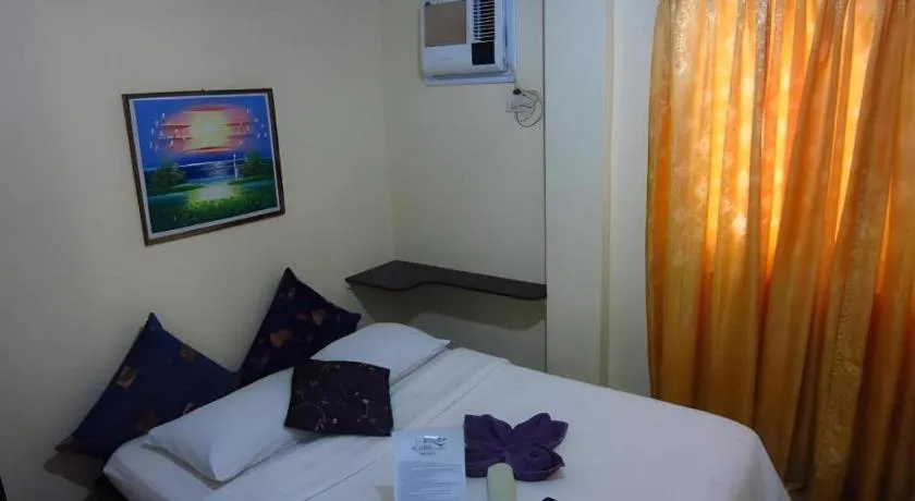 Bed in La Bella Casa Boracay Hotel