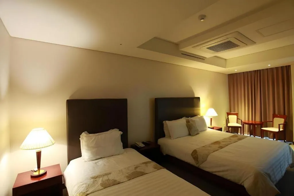 Bed in Hotel Sunshine