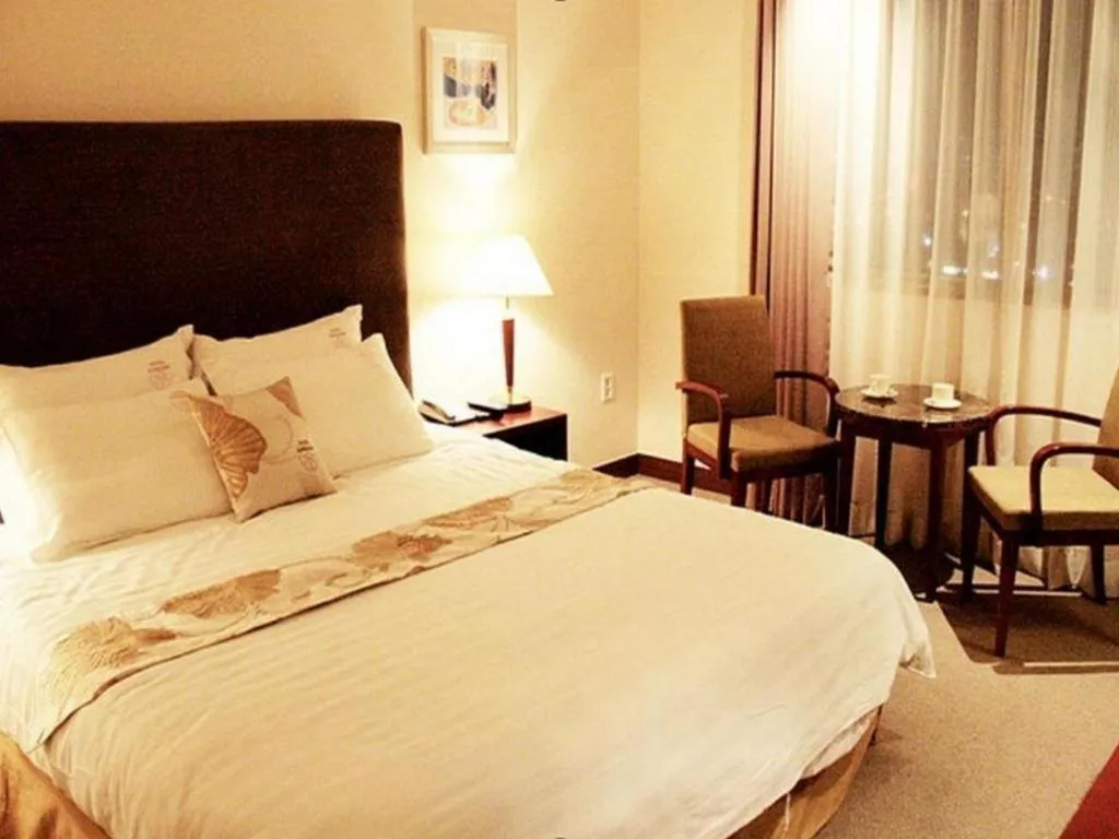 Bed in Hotel Sunshine