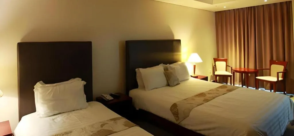 Bed in Hotel Sunshine